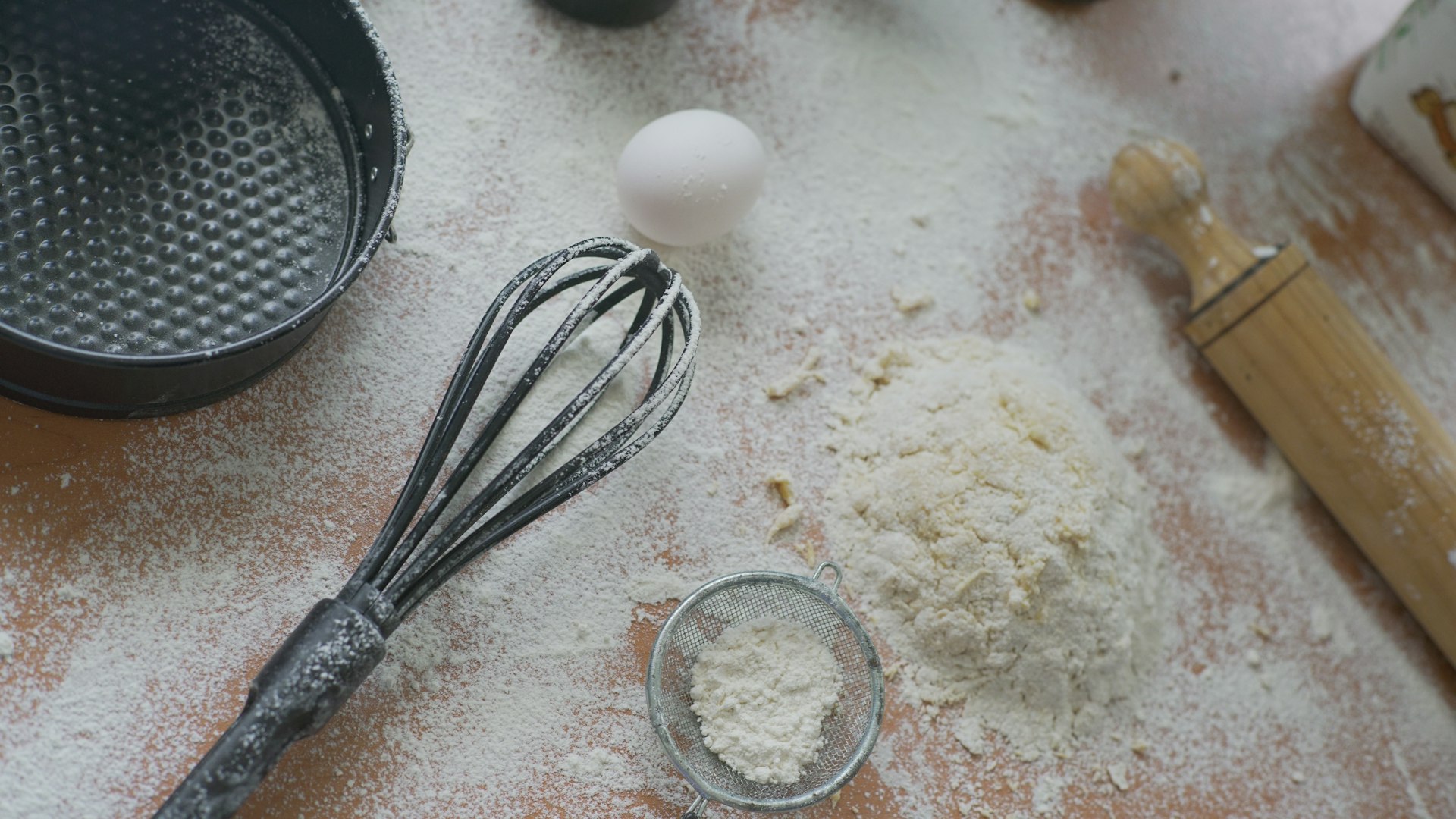 Baking ingredients are prepared on a floured surface.